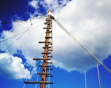 low-angle-view-crane-against-blue-sky (1) low-angle-view-crane-against-blue-sky (1)