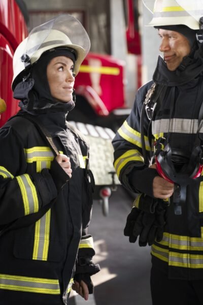 male-female-firefighters-working-together-suits-helmets